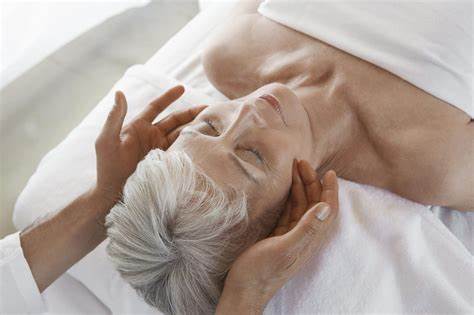 Woman having a massage done while lying down